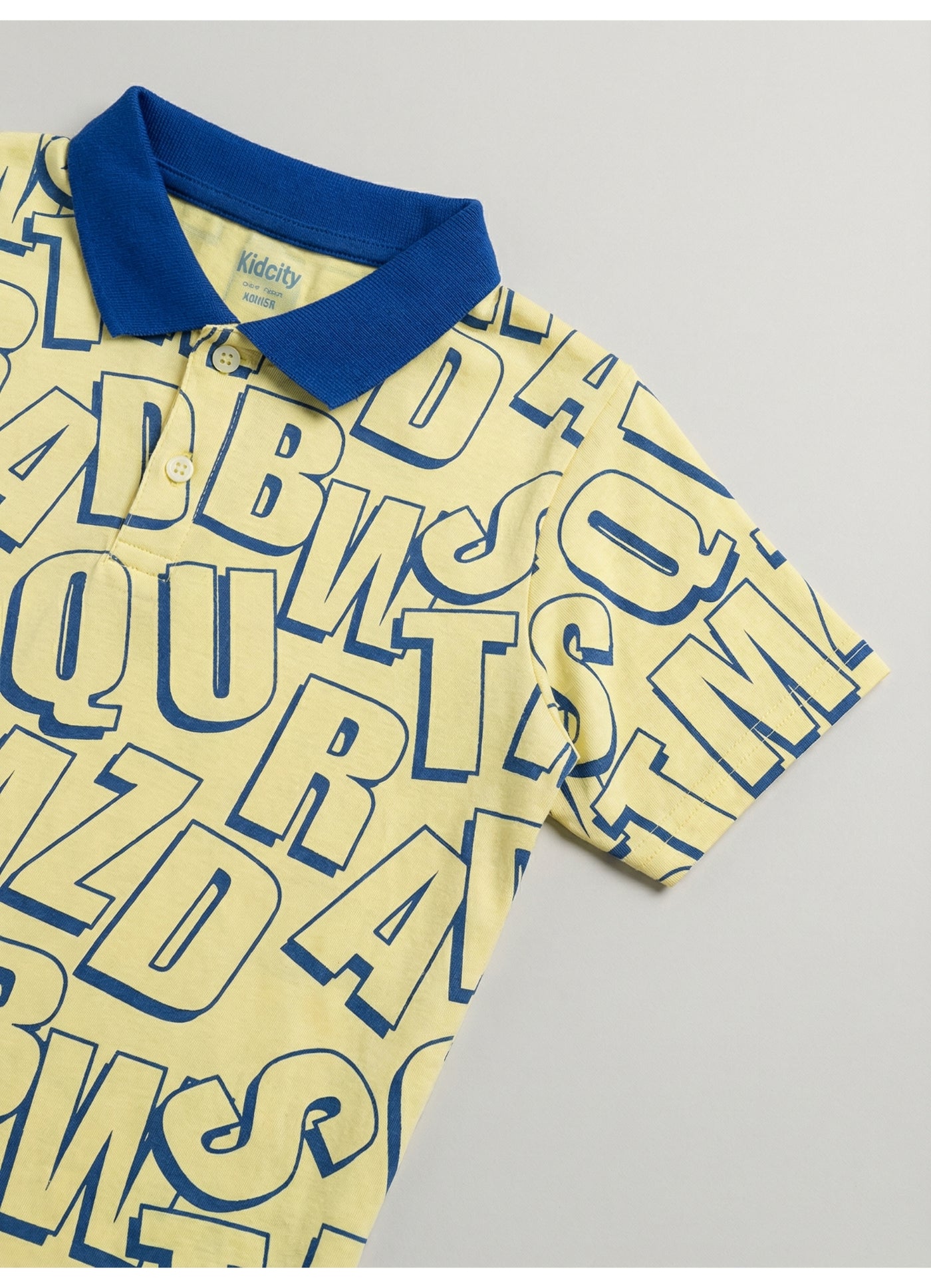 All-Over Alphabet Print Polo T-Shirt.
